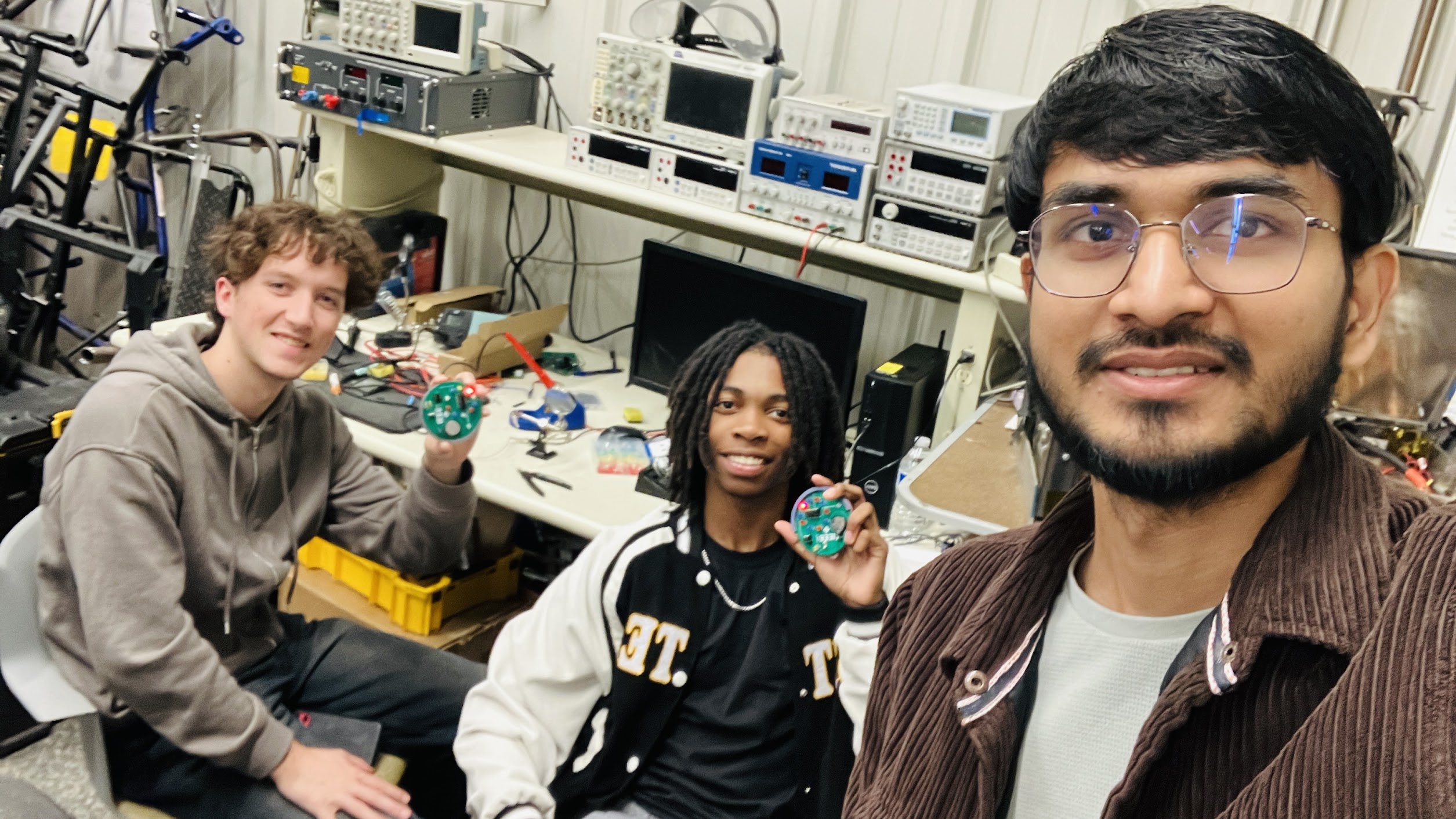 Soldering with students at design studio, purdue university, ece internhsip program